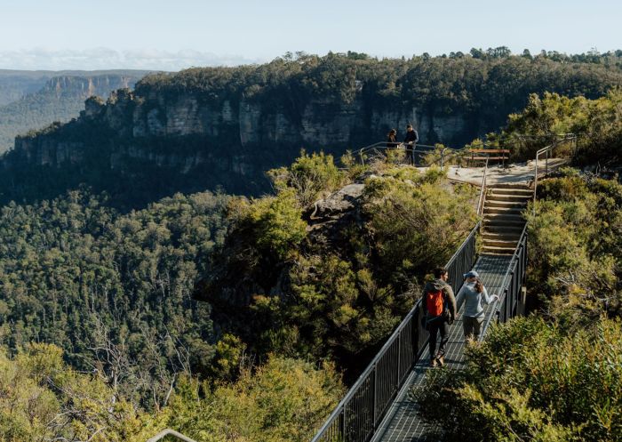 People walking along the Buttenshaw Bridge on the Grand Cliff Top Walk, Blue Mountains