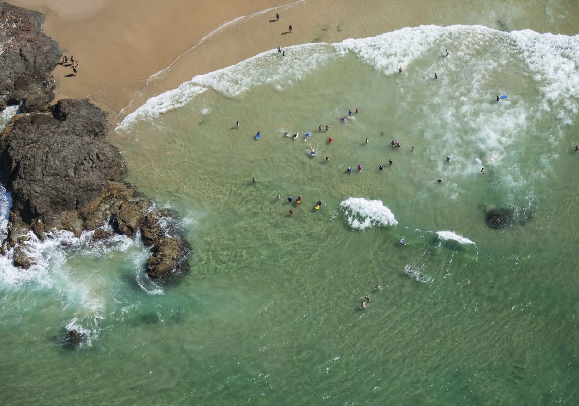 Aerial of people enjoying a sunny day at Town Beach in Port Macquarie, North Coast 