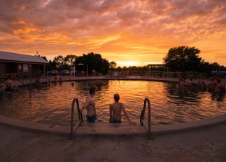 Couple enjoying a visit to the Lightning Ridge Bore Baths, Lightning Ridge