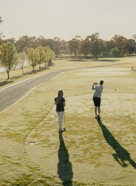 Couple enjoying a round of golf at Rich River Golf Club & Resort, Moama