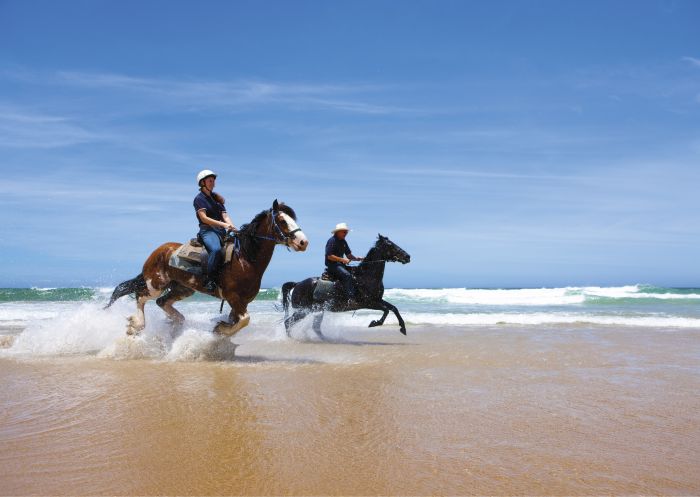 Horse riding along the beach, Worimi Conservation Lands, Port Stephens