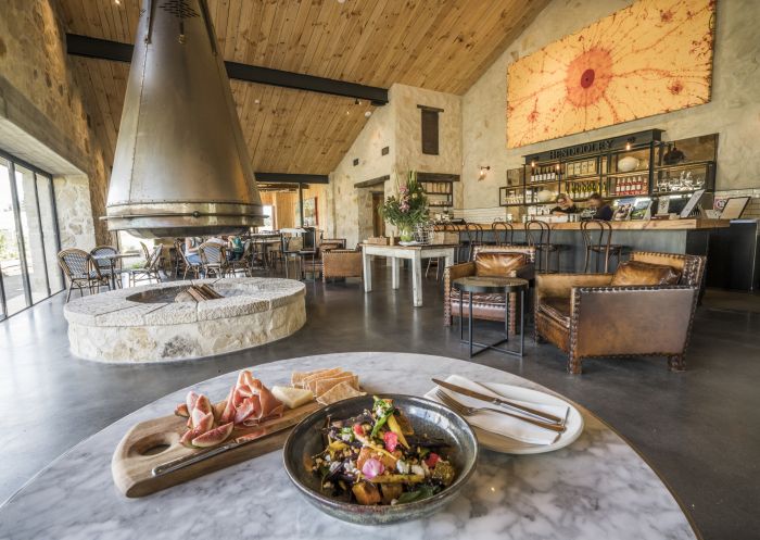 A table of food inside the charming Bendooley Estate, Berrima