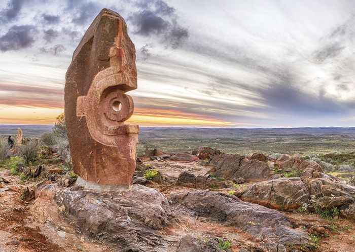 Sun setting over sculpture in The Living Desert in Broken Hill