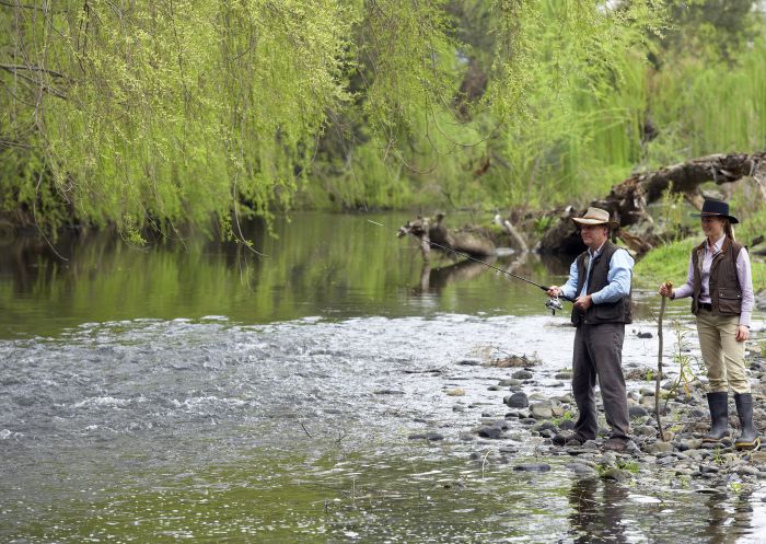 Couple fishing at the stream at Belltrees Estate in Scone, Upper Hunter