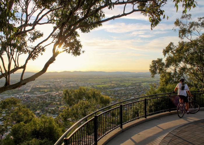 A cyclist enjoying views from the Oxley Scenic Lookout, Tamworth