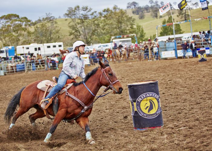 Woman riding a horse at The Annual Gresford Rodeo & Campdraft in Dungog,  Barrington Tops