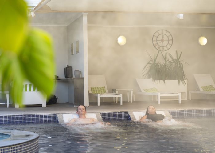 Couple enjoying a relaxing visit to the Moree Artesian Aquatic Centre, Moree