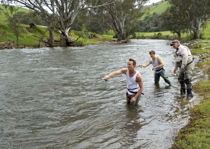 Friends enjoying a fly fishing lessons with guide Dave Ducker on the Goobarragandra River, Tumut