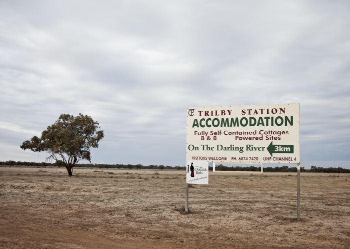 Signs welcoming visitors to Trilby Station, Louth along the Darling River Run