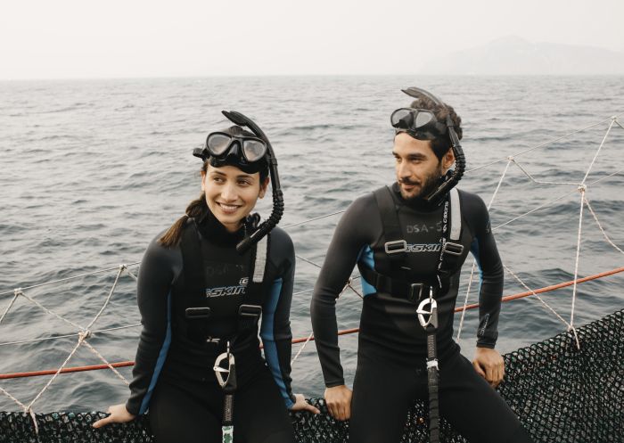 Couple enjoying a day out on the water with Dolphin Swim Australia in Port Stephens, North Coast