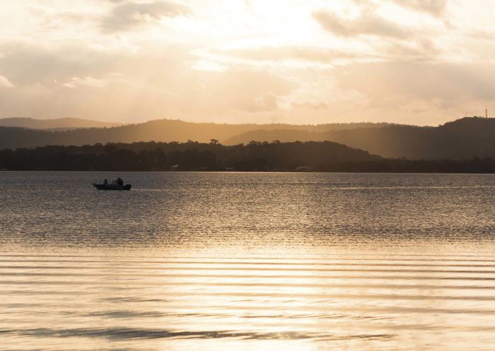 Sun sets over Tuggerah Lake, Long Jetty on the state's Central Coast