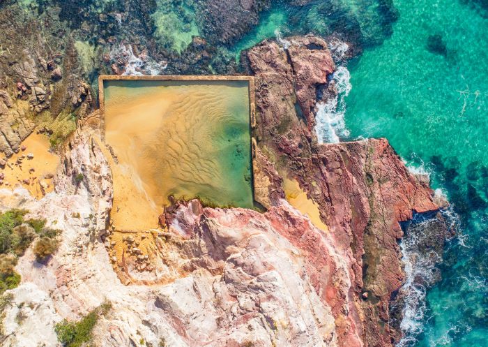 Aerial overlooking Aslings Beach Rock Pool, Eden