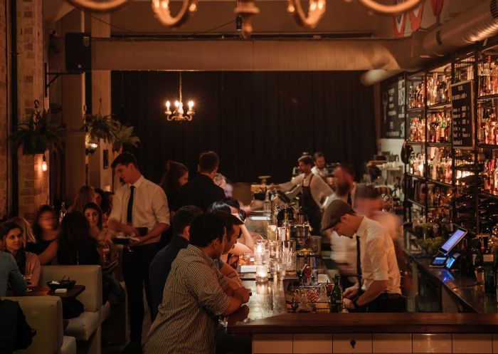 Patrons enjoying drinks at Coal & Cedar, Newcastle