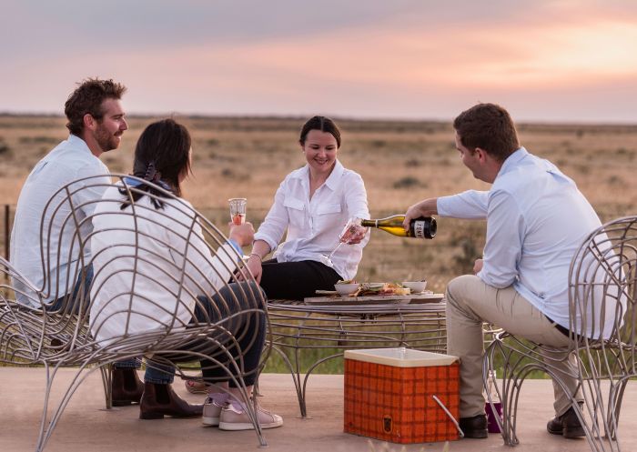 Friends enjoying drinks at Hay Sunset Viewing Area, Hay