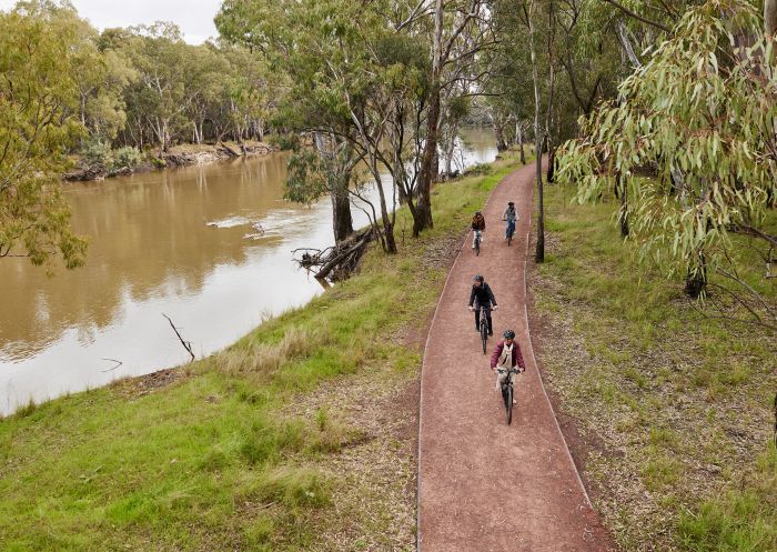 Friends on mountain bikes at Sandy Point Beach Reserve, Hay