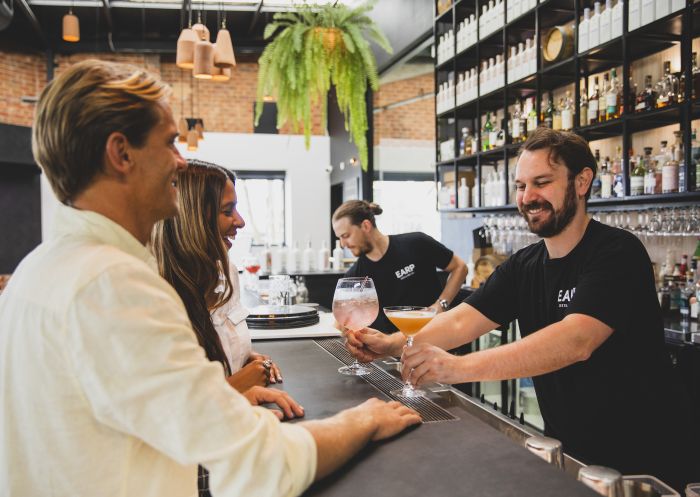 Bartender serving cocktails at Earp Distilling Co., Carrington in Newcastle