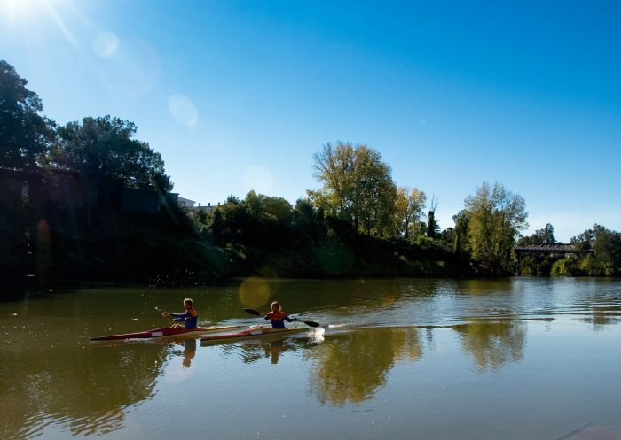 People kayaking on the river along Wilsons River Experience Walk,  Lismore