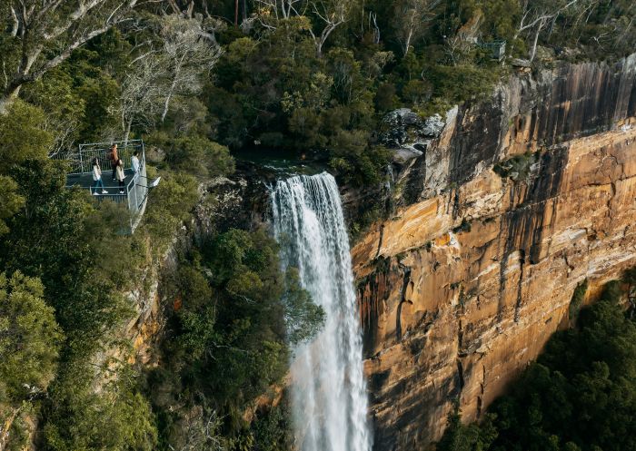 Aerial view of people standing at the viewpoint above Fitzroy Falls, Kangaroo Valley