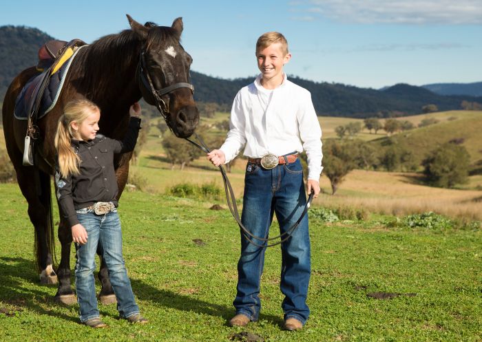 Two children with a horse with Tamworth & Kootingal Horse Riding Adventures, Tamworth