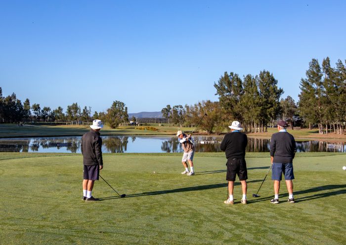 Friends enjoying game of golf at Hunter Valley Golf and Country Club, Pokolbin