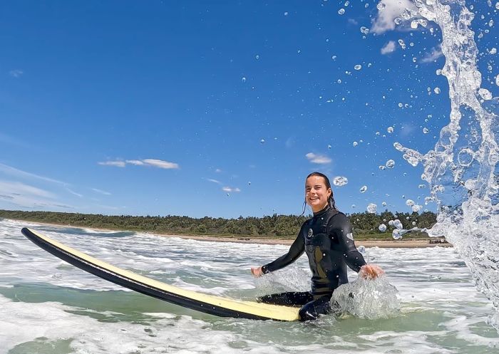 Woman enjoying a surf with Surf Camp Australia, Gerroa