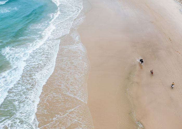 People on a horse ride on the beach with Zephyr Horses, Byron Bay