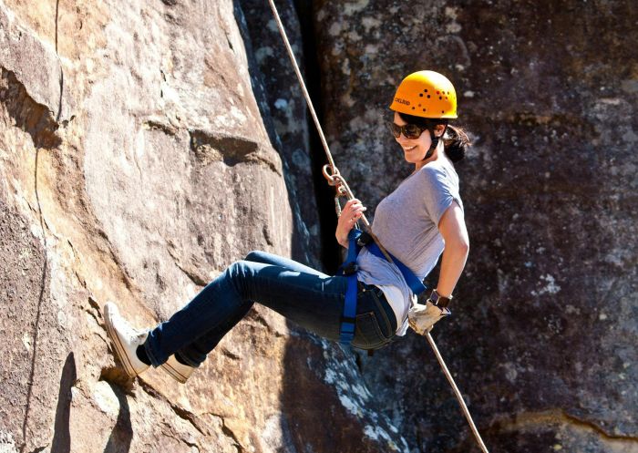 Woman abseiling down rockface with Glenworth Valley Wilderness Adventures, Glenworth Valley