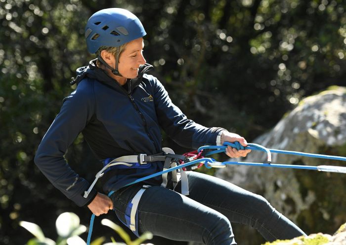 Woman abseiling with Valley Outdoors, Kangaroo Valley