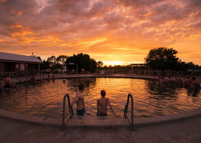 Couple enjoying a visit to the Lightning Ridge Bore Baths in Lightning Ridge, Outback NSW