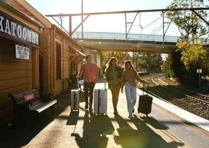 Young people with luggage catching a train at Katoomba Station, Katoomba