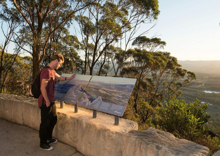 Man reading the lookout guide, Mount York