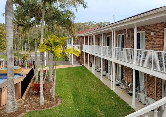 Relax by the pool in peaceful surrounds at the Aston Motel, Yamba