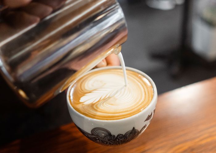 Barista preparing a coffee at Botero Coffee Roasters, Maclean