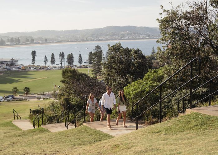 Friends walking to the lookout at the top of The Skillion in Terrigal, Terrigal, Central Coast