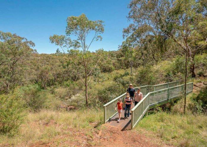 Family walking in Burning Mountain Nature Reserve walking track, Wingen - Credit: John Spencer | DPE