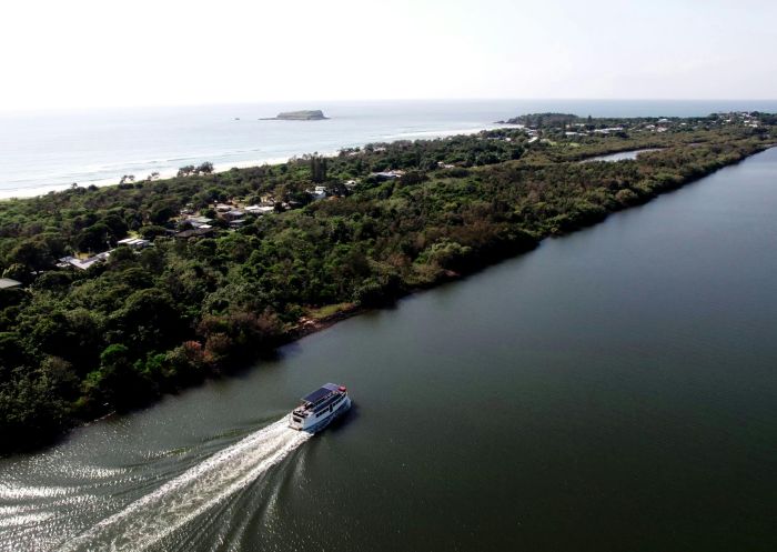 Golden Swan cruising past Fingal on the Tweed River, Tweed Eco Cruises, Tweed Heads - Credit: Jeffery Kiefer Images  