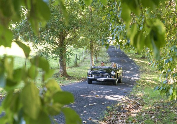 Couple enjoying a scenic drive through Kangaroo Valley on the South Coast