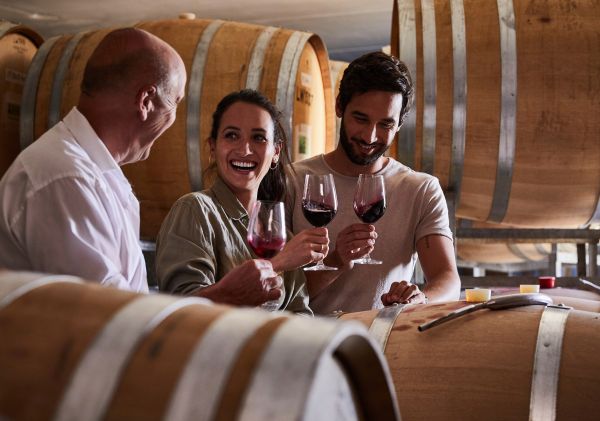 Couple enjoying a wine tasting experience with winemaker David Lowe at Lowe Wines, Mudgee