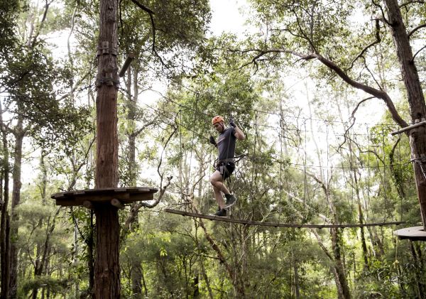 Man enjoying a day out at the TreeTops Adventure, Wyong Creek, Central Coast