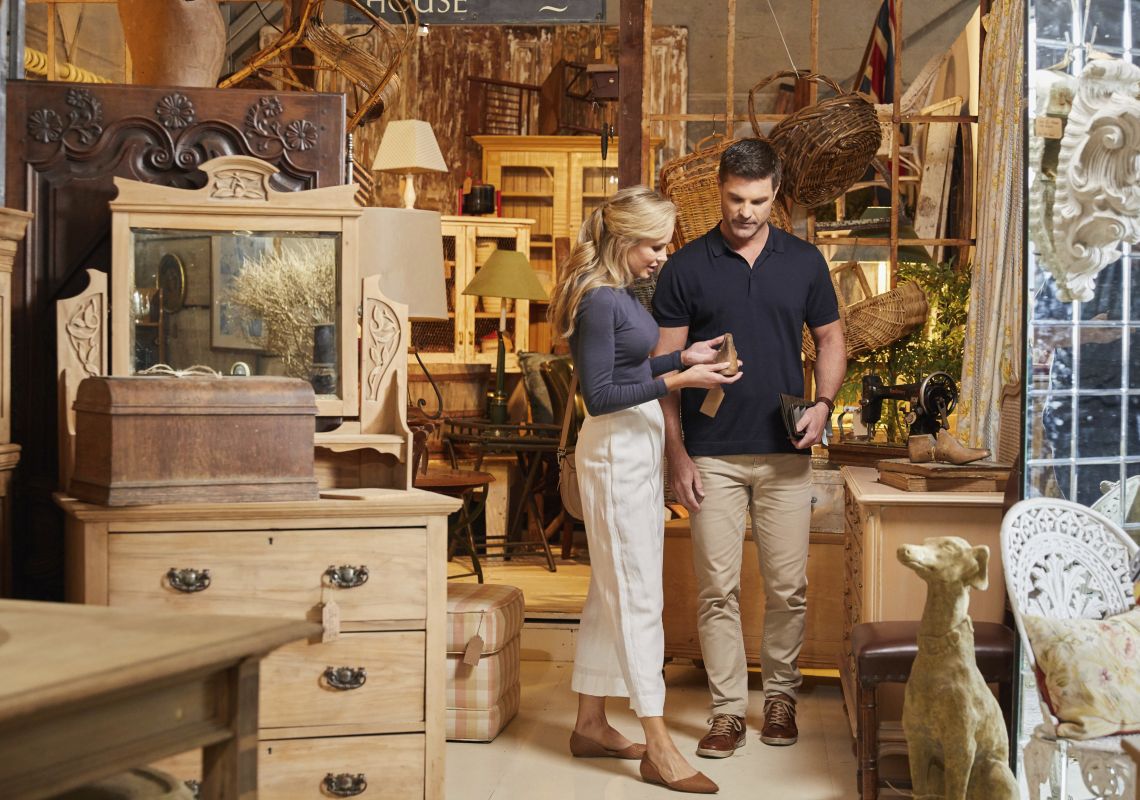 Couple browsing for antiques at Dirty Janes antique market in Bowral, Southern Highlands