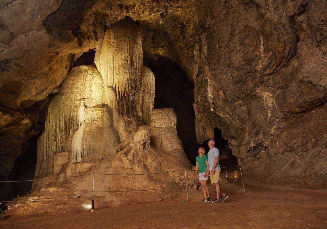 Family exploring the cave systems at Wellington Caves and Phosphate Mines, Wellington.