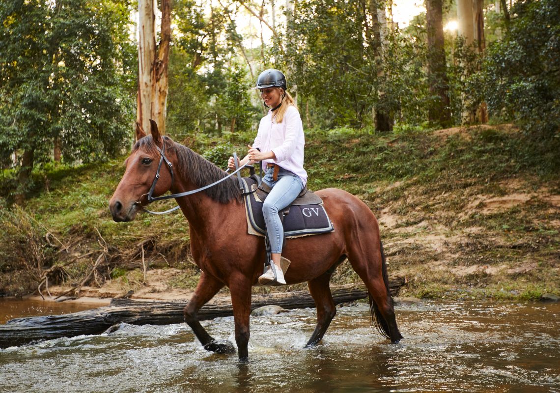 Woman enjoying a horse riding experience with Glenworth Valley Outdoor Adventures, Glenworth Valley