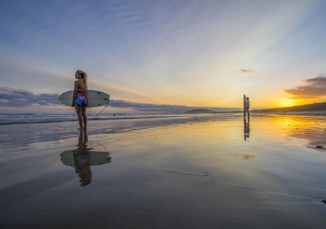 Students at Surf Camp, Gerroa watching the sun set after a day of surfing