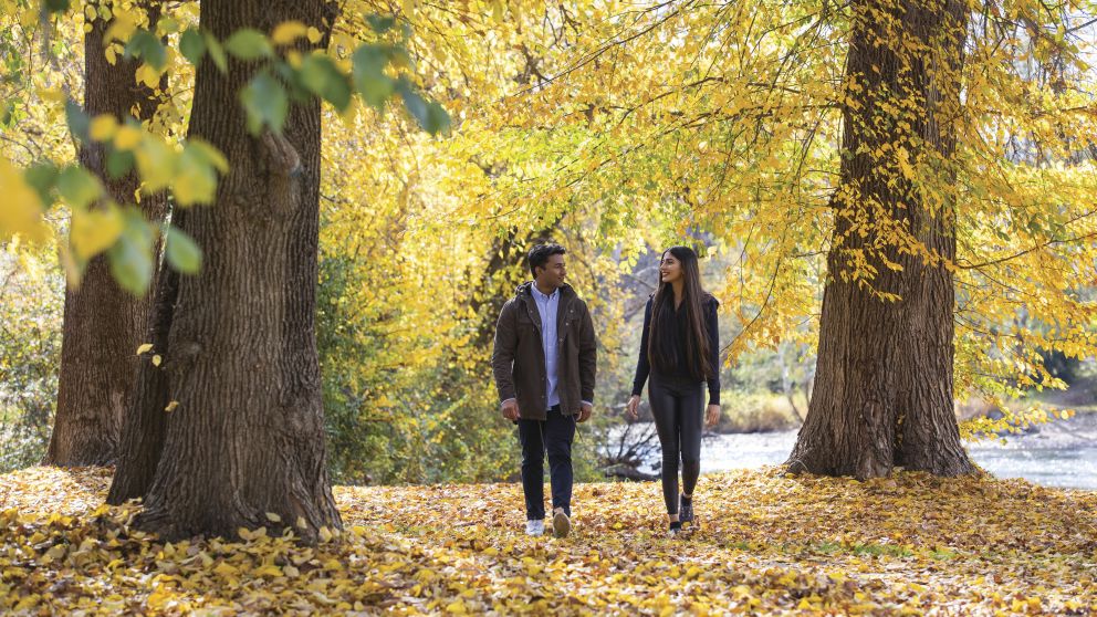 Couple enjoying the autumn colours along the Tumut River Walk