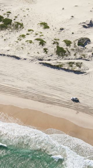 4WD driving along the beach on Worimi Conservation Lands - Port Stephens - North Coast
