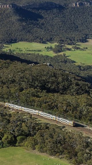 Train passing through Mount Victoria with scenic views of the World-Heritage listed Blue Mountains National Park