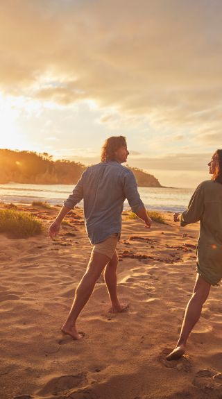 Couple enjoying a visit to McKenzies Beach in Malua Bay, Batemans bay 7  Eurobodalla Area, South Coast