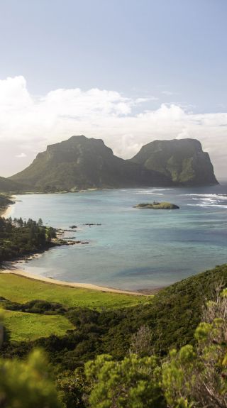 Scenic coastal views across Lord Howe Island to Mount Lidgbird and Mount Gower - Credit: tom-archer.com