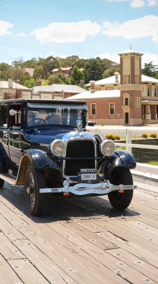 Car driving by the Court House Museum, Carcoar