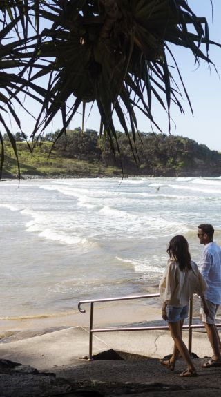 Couple enjoying a day out at Yamba Main Beach in Yamba, North Coast